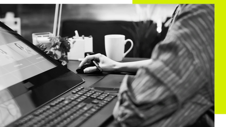 About me, a Cambridge based freelance website and digital content designer A black and white image of me, freelancing on a digital content project.